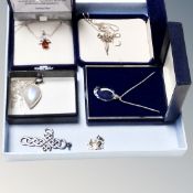 A collection of four silver chains,