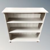 A set of painted pine bookshelves on bun feet