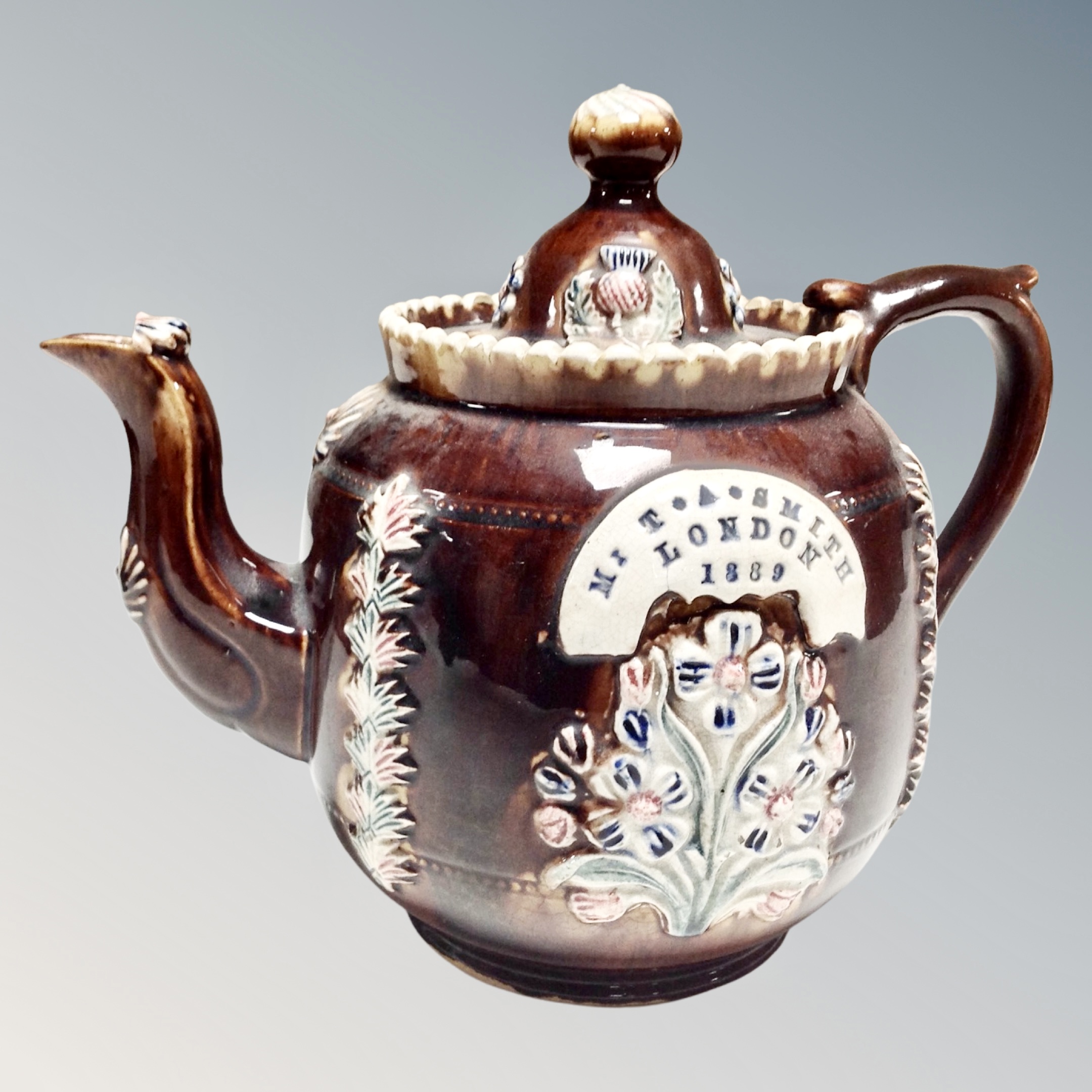 A Victorian bargeware teapot by T A Smith of London dated 1889