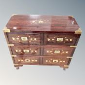 A Chinese hardwood brass inlaid four drawer campaign style chest,