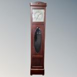 An early 20th century longcase clock with silvered dial