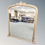 A Victorian gilt framed arch topped overmantel mirror,