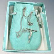 A Tiffany and Co silver crucifix pendant on chain in retail box