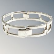 A Gucci silver hinged bracelet in retail box, 58.8g.