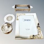 A silver plated photograph frame together with plated stand, small photograph frame and pot.