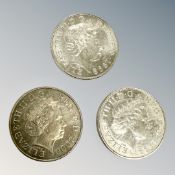 Three £5 coins.