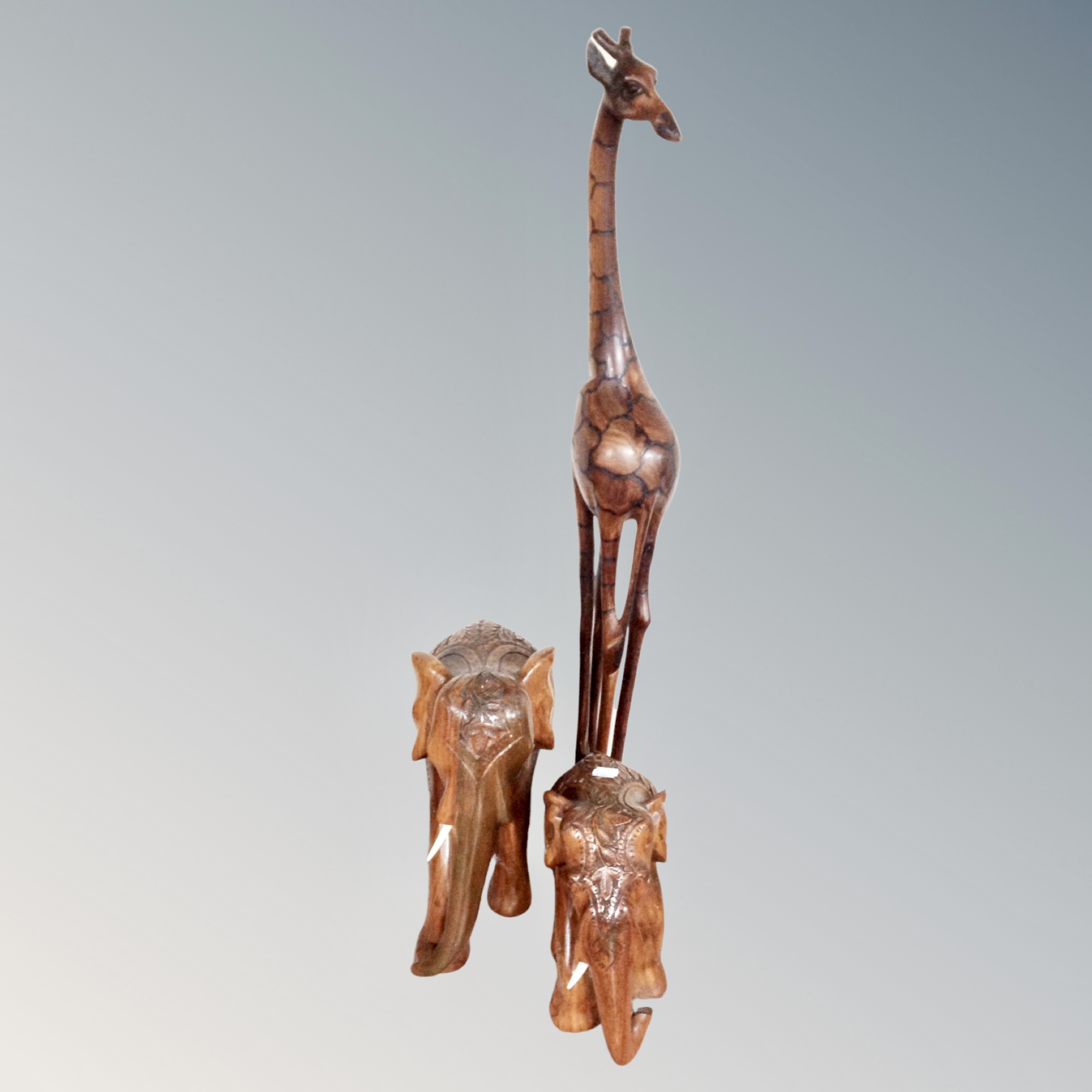 A carved hardwood figure of a giraffe,