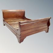 A mahogany hardwood 5' sleigh bed frame