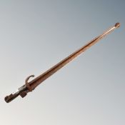 A set of antique fire tongs made from a French bayonet