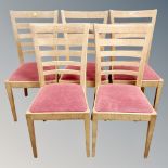 A set of five contemporary oak ladder backed chairs