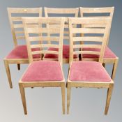 A set of five contemporary oak ladder backed chairs