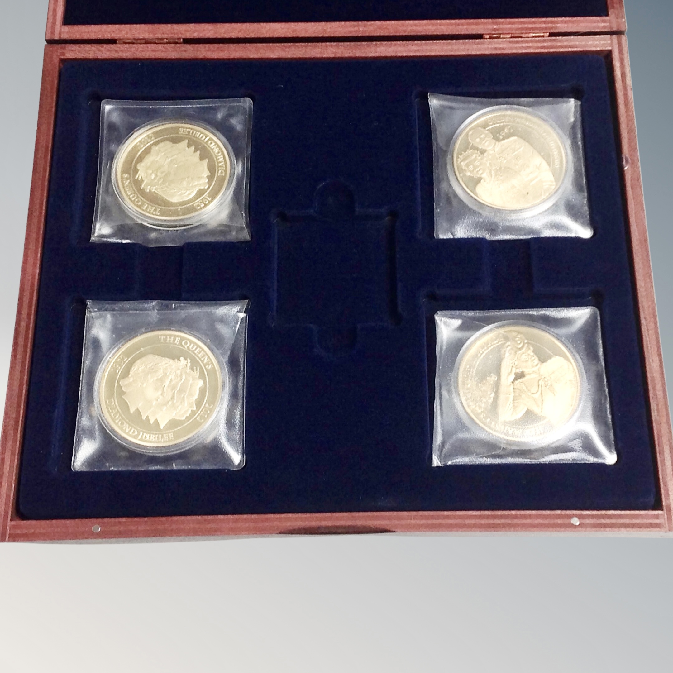 A set of four 24ct gold plated Queen's Jubilee commemorative coins in case