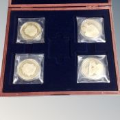A set of four 24ct gold plated Queen's Jubilee commemorative coins in case