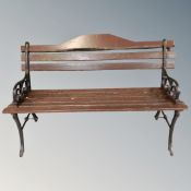 A wooden slatted and wrought iron garden bench