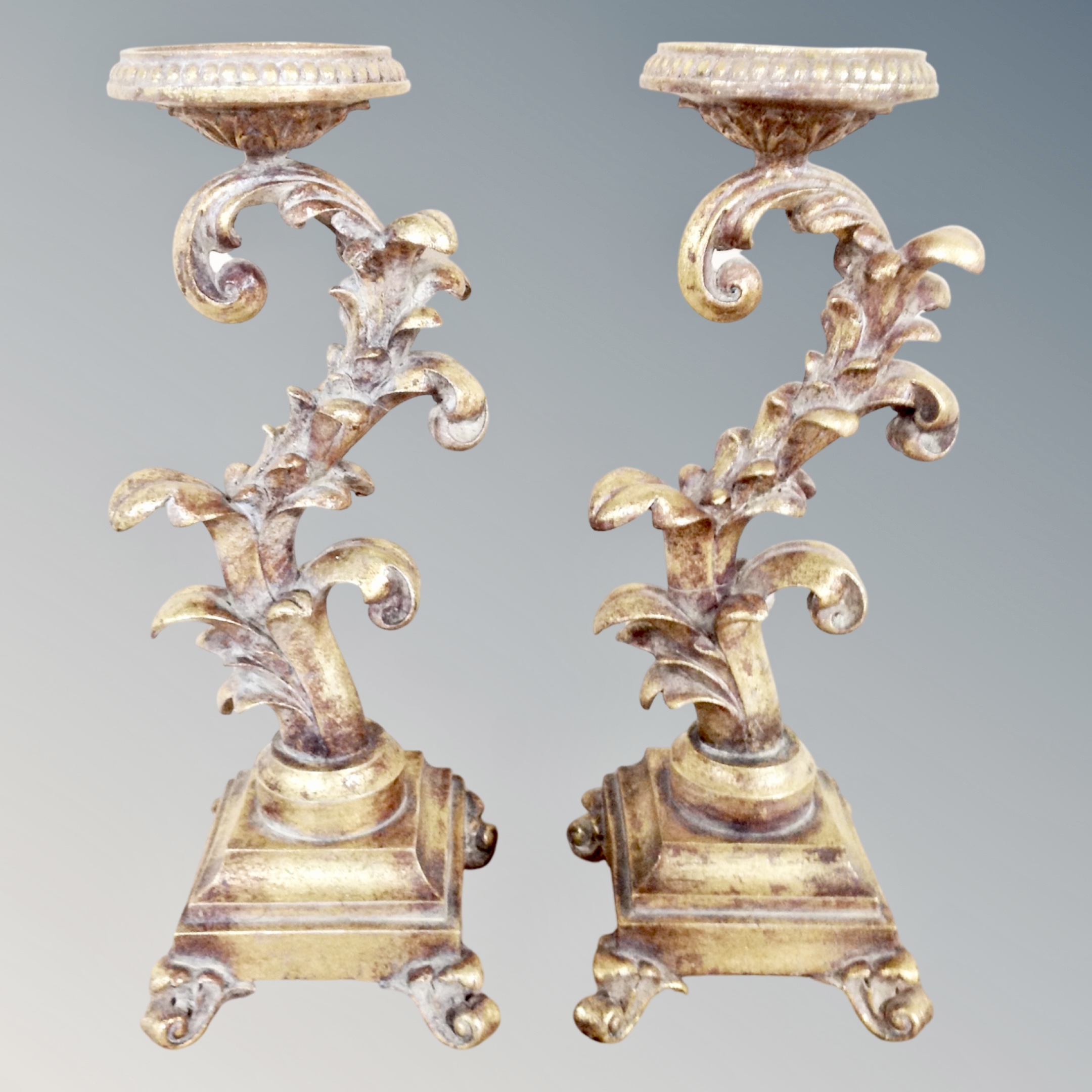 Two ornate gilt candle holders