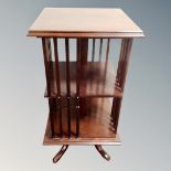 A Victorian style revolving bookstand in a mahogany finish