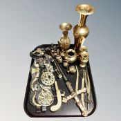 A tray of antique and later brass wares, miniature candlesticks, horse brasses,