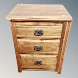 An Edwardian three drawer pedestal chest