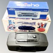 A Saisho stereo radio cassette recorder, boxed, together with an Arbiter Karaoke blaster,