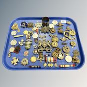 A large quantity of mainly military decorations and medals, cap badges,