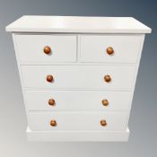 A painted pine five drawer chest together with a painted pine bedside cabinet