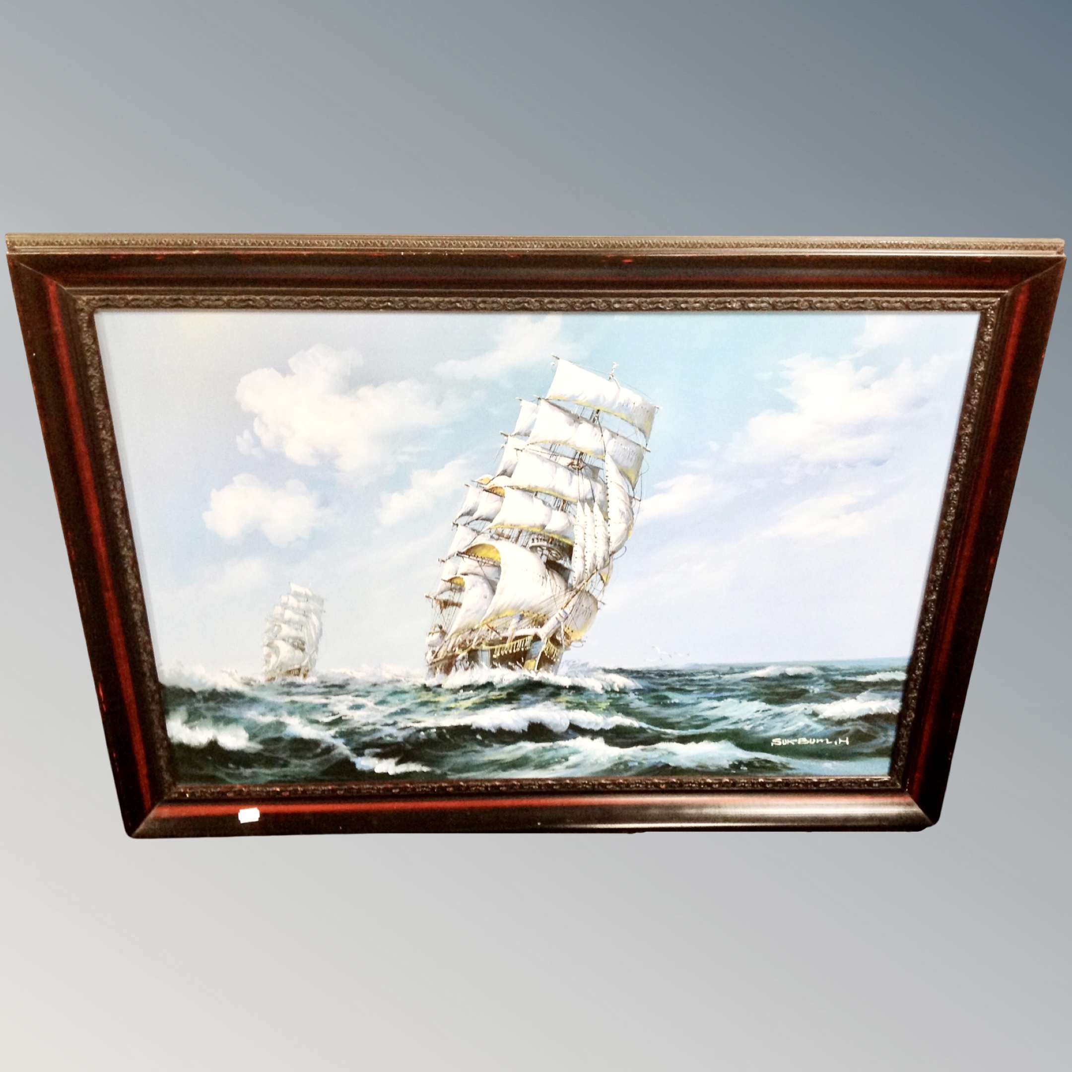 An oil on canvas depicting tall ships at full sail