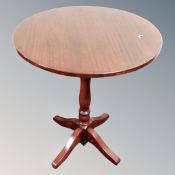 A circular pedestal table