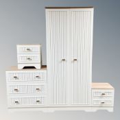 A contemporary two tone double door hanging wardrobe together with matching there drawer chest and