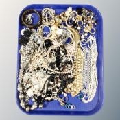 A tray of costume jewellery, earrings, necklaces,