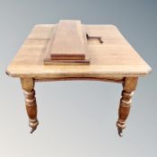 A Victorian oak wind-out dining table with two leaves, set of four chairs.