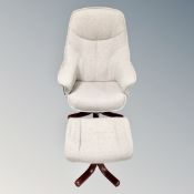 A swivel relaxer adjustable armchair with foot stool upholstered in a grey fabric.