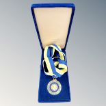 A Paul Harris Fellow Rotary medallion on ribbon