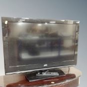 A JVC 32 inch LCD TV with remote