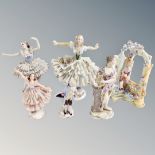 Four 19th century German lace porcelain figurines together with two continental figures