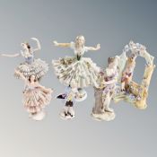 Four 19th century German lace porcelain figurines together with two continental figures