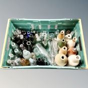 A crate of antique glass and stoneware bottles