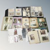 A box of six books and folders containing antique and later postcards,