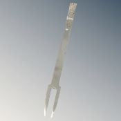 A cast solid sliver copy of a 17th century fork dated 1632,