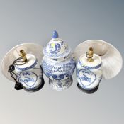 A pair of Chinese style blue and white barrel lamps with shades together with further Chinese blue