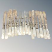 Sixteen mother of pearl handled EPNS knives and forks