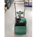 A Qualcast classic petrol 35S lawnmower with grass box