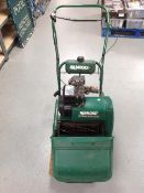 A Qualcast classic petrol 35S lawnmower with grass box