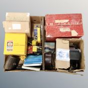 Two boxes of vintage home movie equipment, projector's editor's reels,