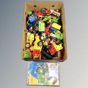 A box of Meccano junior construction kits and book