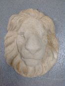 A concrete lion mask plaque