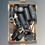A box of various camera lenses,
