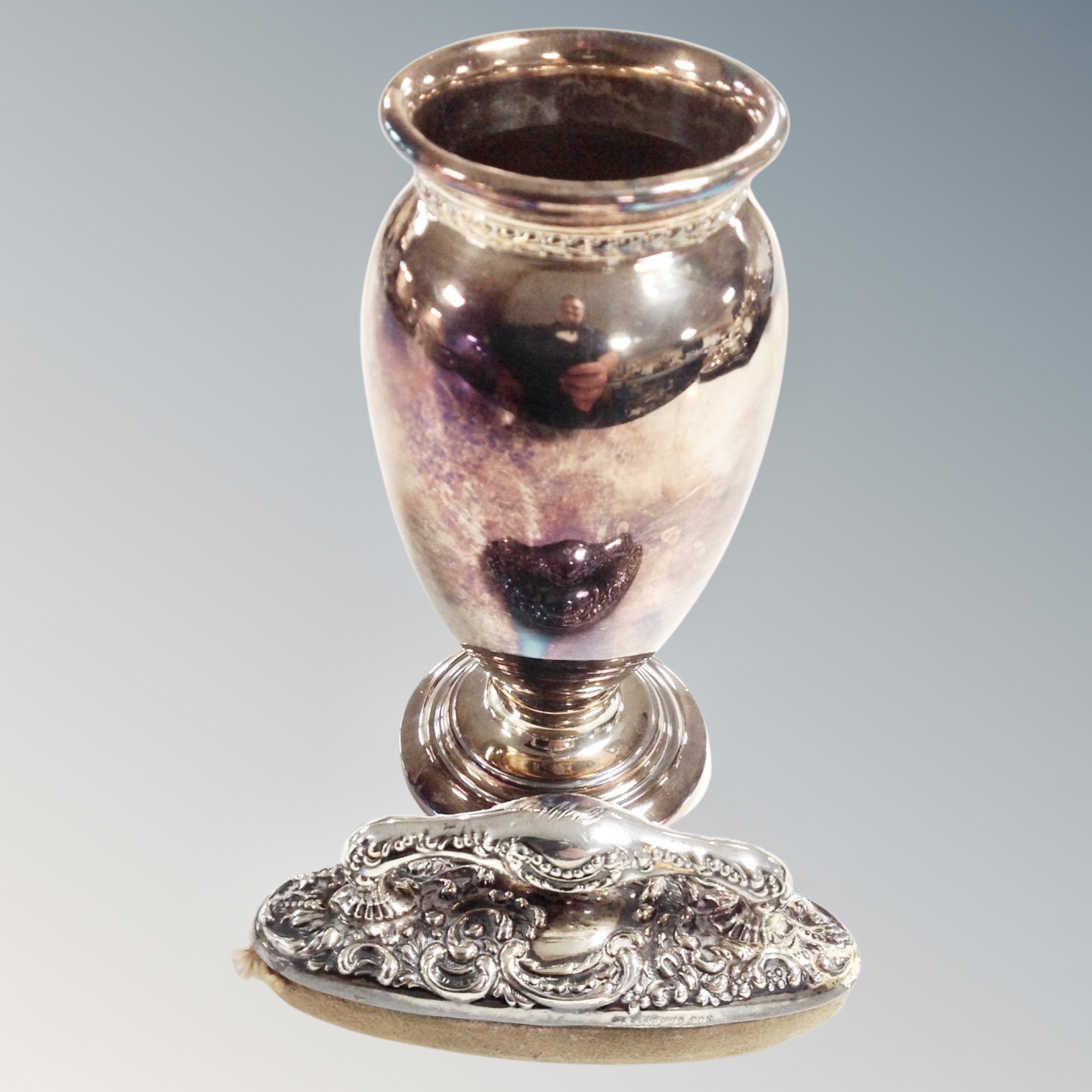 A silver vase, Birmingham 1923, height 11.5 cm, together with a sterling silver-backed nail buffer.