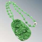 A large good quality jade pendant and necklace