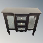 A French style break fronted double door cabinet with three central drawers and mirrored panels on