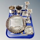 A tray of plated wares including pair of candlesticks, shell dish, letter opener, ashstray,